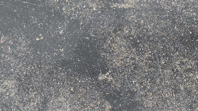 white and black stone on gray concrete floor